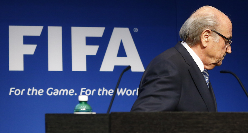 FIFA President Blatter leaves after his statement during a news conference at the FIFA headquarters in Zurich