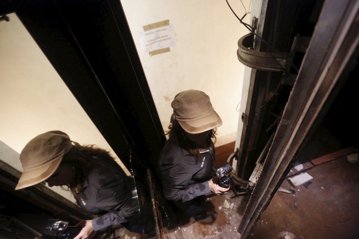 in-this-photo-a-journalist-slides-behind-the-mirror-into-a-secret-passageway