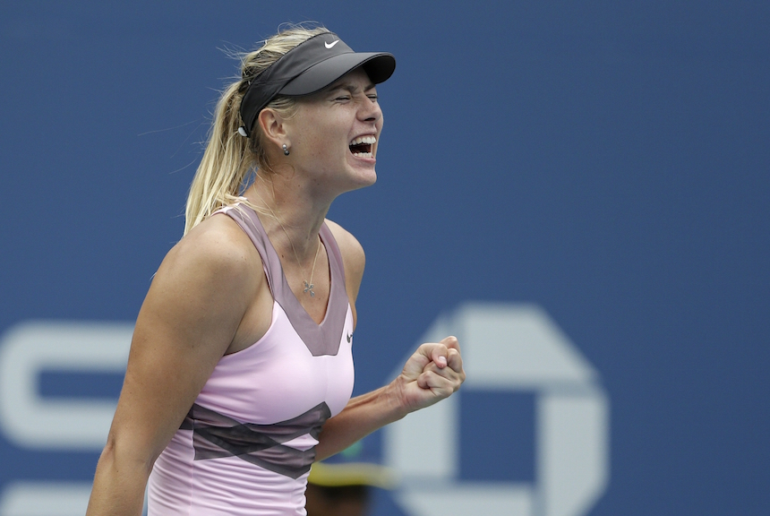 Russia's Maria Sharapova celebrates during her match with Marion Bartoli, of France, in the quarterfinals during the 2012 US Open tennis tournament, Wednesday, Sept. 5, 2012, in New York. (AP Photo/Darron Cummings)