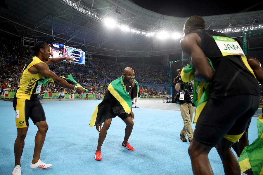 RIO DE JANEIRO, BRAZIL - AUGUST 19: Usain Bolt of Jamaica celebrates with teammates Asafa Powell, Yohan Blake and Nickel Ashmeade after they won the Men's 4 x 100m Relay Final on Day 14 of the Rio 2016 Olympic Games at the Olympic Stadium on August 19, 2016 in Rio de Janeiro, Brazil. (Photo by Cameron Spencer/Getty Images)