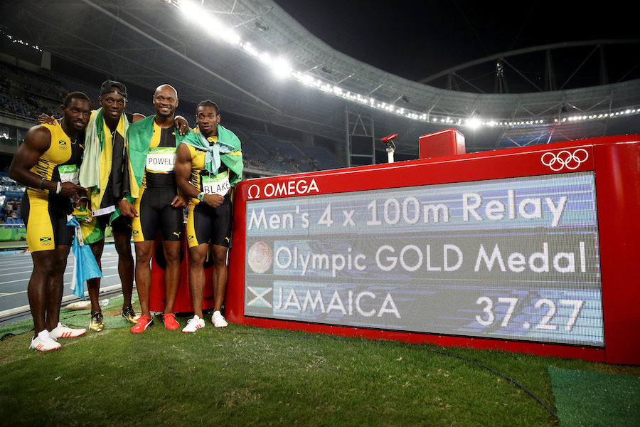 RIO DE JANEIRO, BRAZIL - AUGUST 19: Usain Bolt of Jamaica celebrates with teammates Asafa Powell, Yohan Blake and Nickel Ashmeade after they won the Men's 4 x 100m Relay Final on Day 14 of the Rio 2016 Olympic Games at the Olympic Stadium on August 19, 2016 in Rio de Janeiro, Brazil. (Photo by Cameron Spencer/Getty Images)