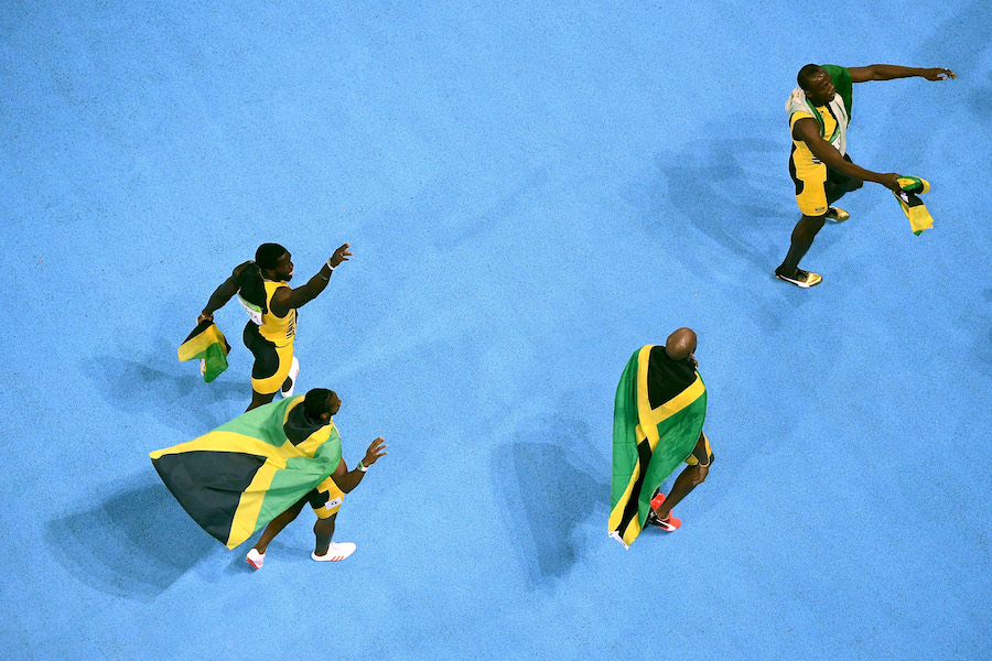 RIO DE JANEIRO, BRAZIL - AUGUST 19: Usain Bolt of Jamaica celebrates with teammates Asafa Powell, Yohan Blake and Nickel Ashmeade after they won the Men's 4 x 100m Relay Final on Day 14 of the Rio 2016 Olympic Games at the Olympic Stadium on August 19, 2016 in Rio de Janeiro, Brazil. (Photo by Richard Heathcote/Getty Images)