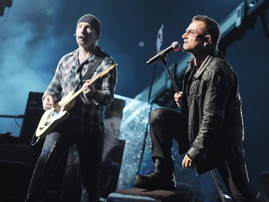 PASADENA, CA - OCTOBER 25: Musician The Edge (L) and singer Bono of U2 perform onstage during their "360 Degrees Tour" at the Rose Bowl on October 25, 2009 in Pasadena, California. (Photo by Kevin Winter/Getty Images) *** Local Caption *** Bono;The Edge