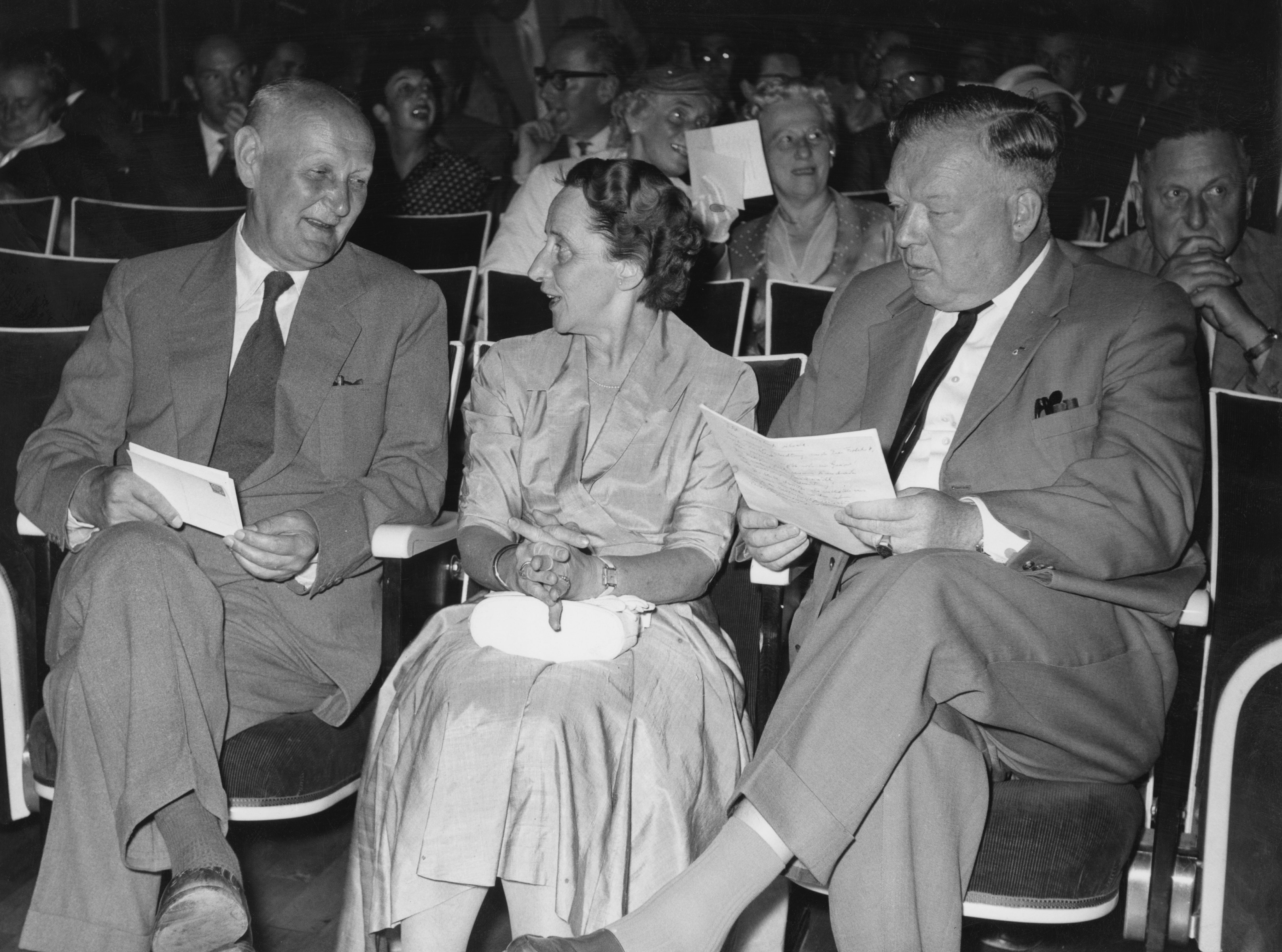 Guests at the 7th meeting of Nobel Prize-winners, Lindau, Germany, 3rd July 1957. On the left is German pathologist Gerhard Domagk (1895 - 1964) and on the right is German doctor Werner Forssmann (1904 - 1979). Behind Forssmann is Swiss chemist Paul Hermann Muller (1899 - 1965). (Photo by Keystone/Hulton Archive/Getty Images)