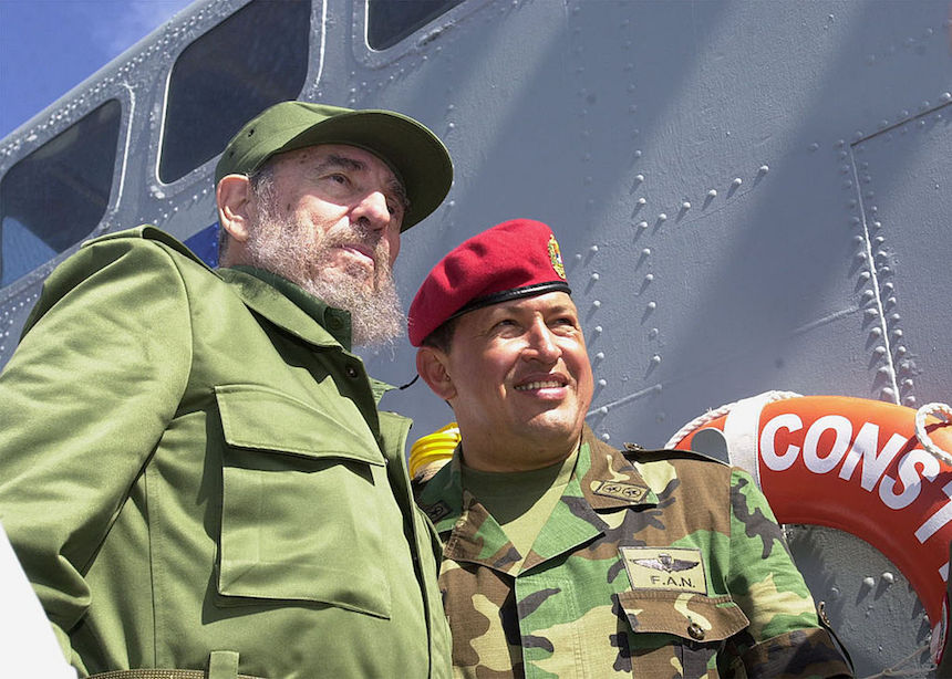 398480 01: Cuban President Fidel Castro (L) and Venezuelan President Hugo Chavez travel onboard a Venezuelan Navy vessel from Porlamar to Pampatar prior a ceremony to promulgate a new Fishing Law, December 11, 2001 at Margarita Island, Venezuela. Castro is in Panpatar to attend the two-day meeting of the Association of Caribbean States (ACS). (Photo by Miraflores/Getty Images)