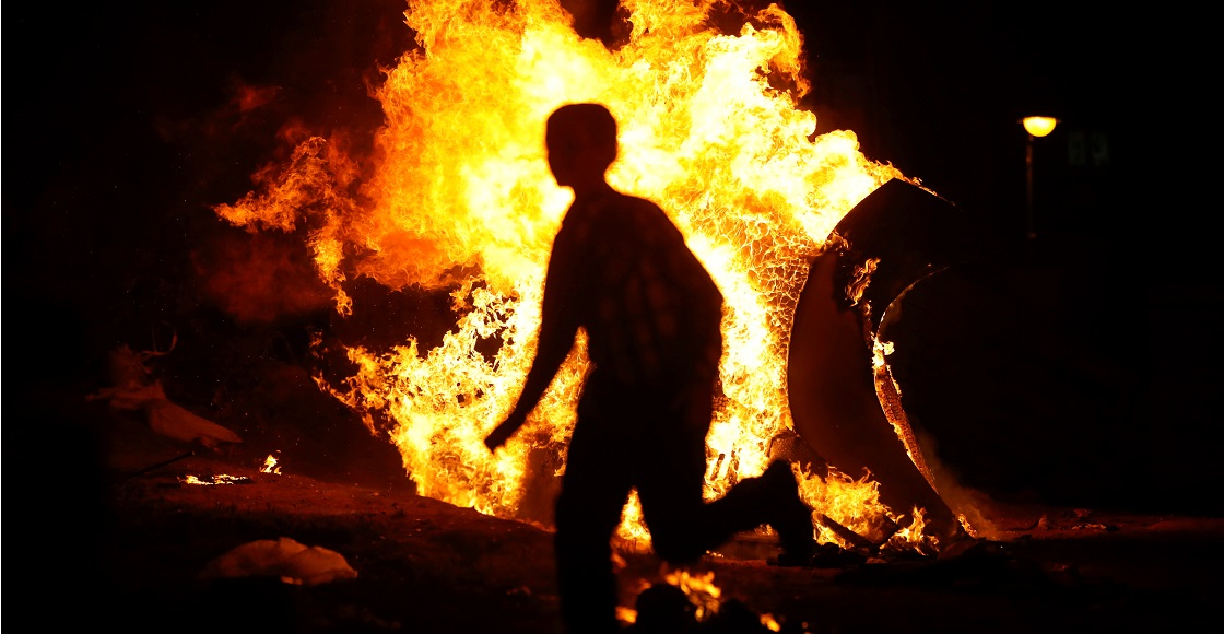 A boy runs around a bonfire as Ultra-Orthodox Jews mark the Jewish holiday of Lag Ba'Omer in Bnei Brak, near Tel Aviv, Israel, April 29, 2021.