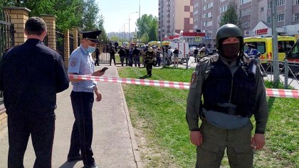 Law enforcement officers work outside School Number 175 following a recent shooting in Kazan, Russia May 11, 2021, in this screen grab taken from video. Reuters TV via