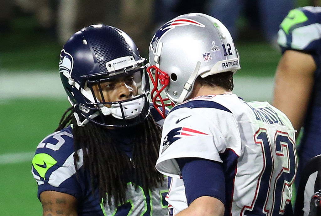 Richard Sherman junto a Tom Brady