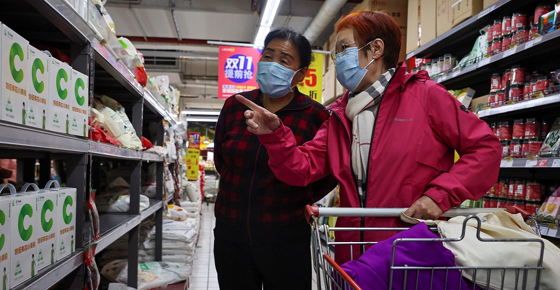 People look at products in the flour section of a supermarket following outbreak of the coronavirus disease (COVID-19) in Beijing, China, November 3, 2021.