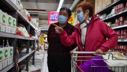 People look at products in the flour section of a supermarket following outbreak of the coronavirus disease (COVID-19) in Beijing, China, November 3, 2021.